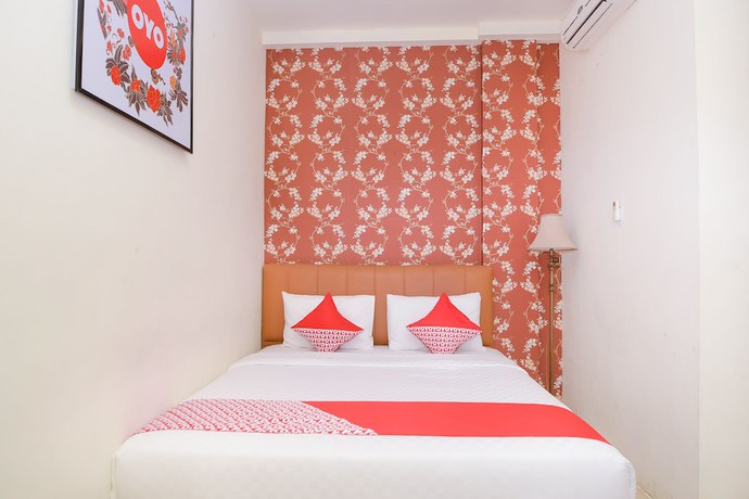 Imagen de la habitación del Hotel Capital O 854 Ub Caisar. Foto 13