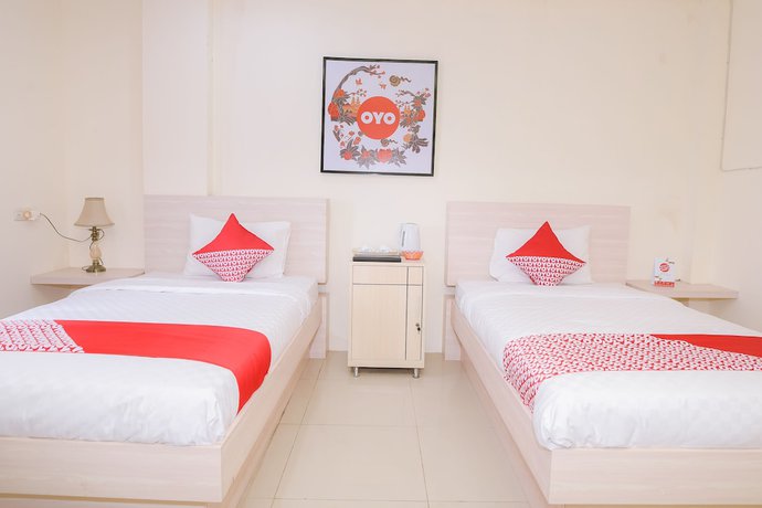 Imagen de la habitación del Hotel Capital O 854 Ub Caisar. Foto 15