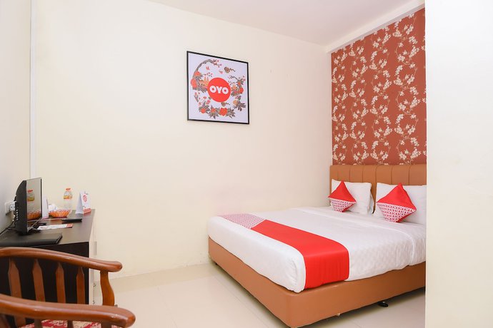 Imagen de la habitación del Hotel Capital O 854 Ub Caisar. Foto 16