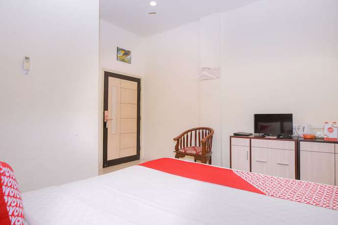 Imagen de la habitación del Hotel Capital O 854 Ub Caisar. Foto 17