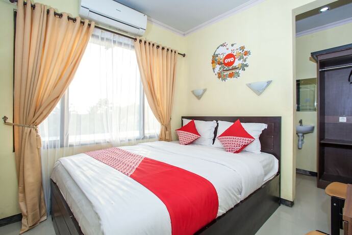 Imagen de la habitación del Hotel Capital O 887 Green Hill And Convention Center. Foto 13