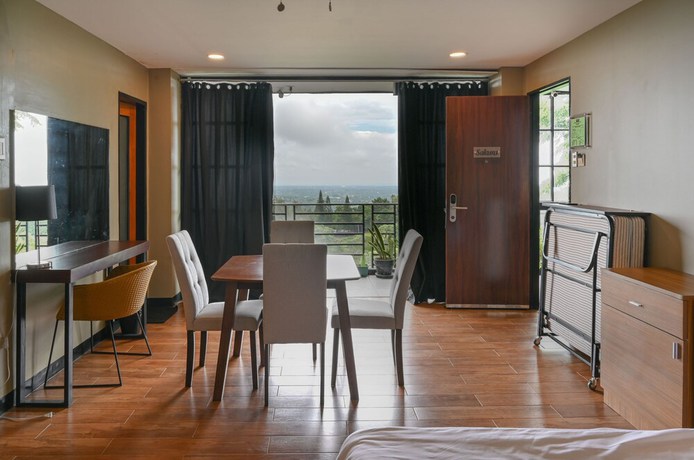 Imagen de la habitación del Hotel Capital O 890 Nami Tagaytay. Foto 9