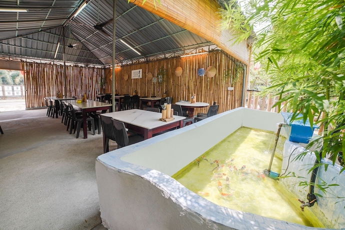 Imagen del bar/restaurante del Hotel Capital O 89374 Ohana Restaurant and Homestay. Foto 6