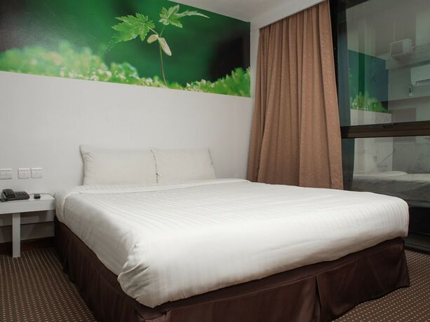 Imagen de la habitación del Hotel Capital O 90083 Riverfront Inn. Foto 2