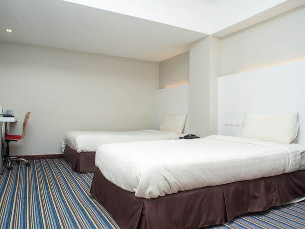 Imagen de la habitación del Hotel Capital O 90083 Riverfront Inn. Foto 5