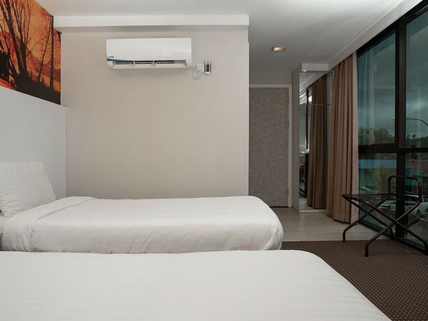 Imagen de la habitación del Hotel Capital O 90083 Riverfront Inn. Foto 9