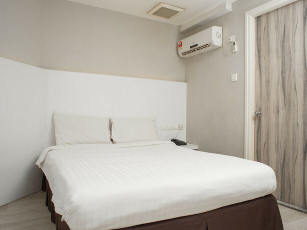 Imagen de la habitación del Hotel Capital O 90083 Riverfront Inn. Foto 10