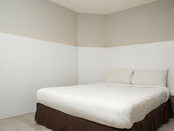 Imagen de la habitación del Hotel Capital O 90083 Riverfront Inn. Foto 11