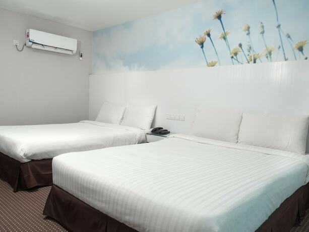 Imagen de la habitación del Hotel Capital O 90083 Riverfront Inn. Foto 12
