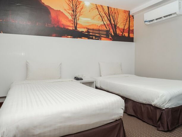 Imagen de la habitación del Hotel Capital O 90083 Riverfront Inn. Foto 14