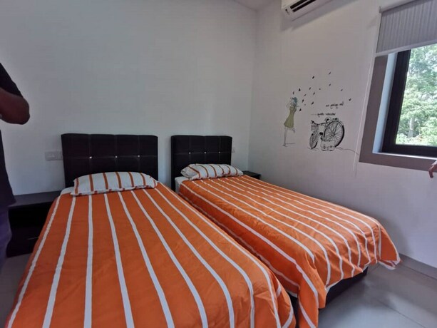 Imagen de la habitación del Hotel Capital O 90088 Mbp Leisure Resort. Foto 11