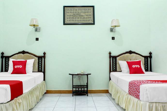 Imagen de la habitación del Hotel Capital O 90417 Batu Suli Internasional. Foto 6