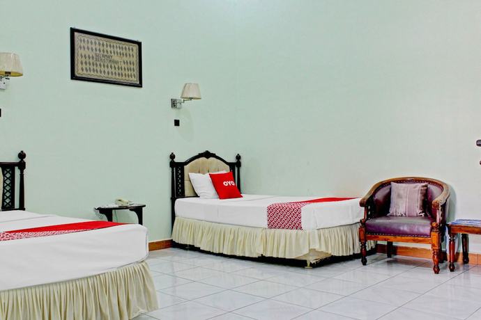 Imagen de la habitación del Hotel Capital O 90417 Batu Suli Internasional. Foto 9