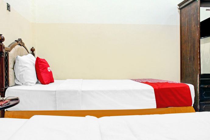 Imagen de la habitación del Hotel Capital O 90417 Batu Suli Internasional. Foto 10