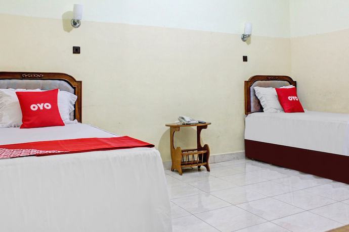 Imagen de la habitación del Hotel Capital O 90417 Batu Suli Internasional. Foto 14