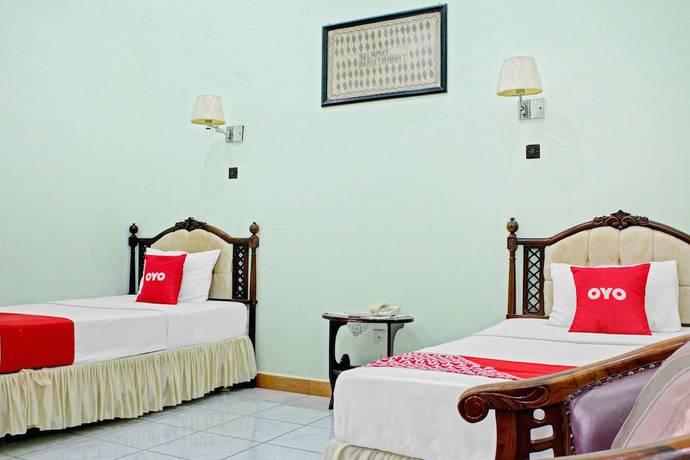 Imagen de la habitación del Hotel Capital O 90417 Batu Suli Internasional. Foto 18