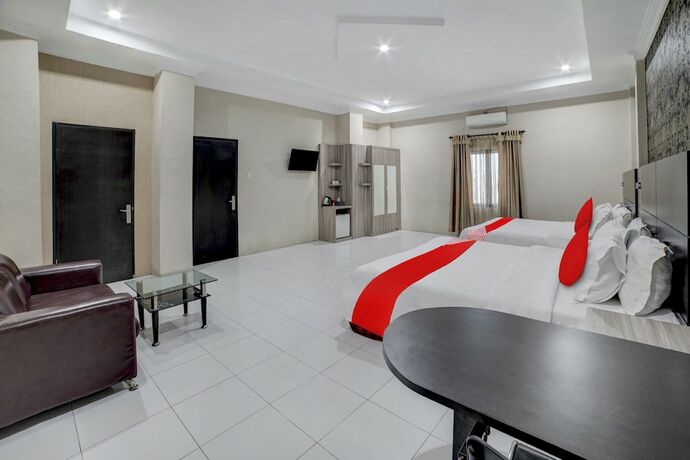 Imagen de la habitación del Hotel Capital O 90601 Meuligoe. Foto 12