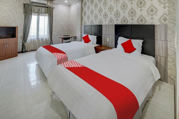 Imagen de la habitación del Hotel Capital O 90601 Meuligoe. Foto 15