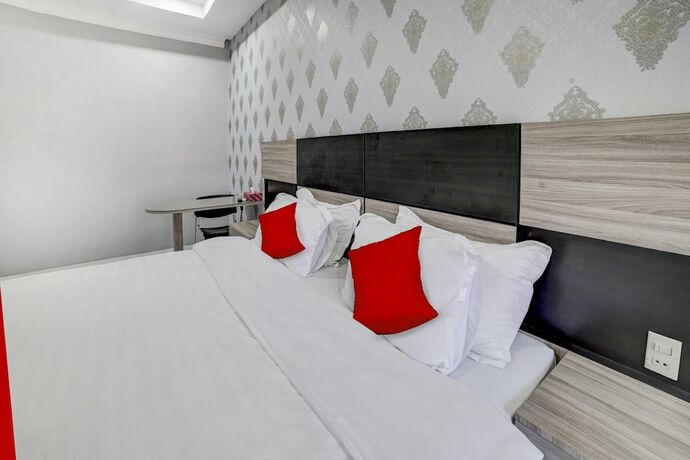 Imagen de la habitación del Hotel Capital O 90601 Meuligoe. Foto 16