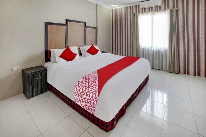 Imagen de la habitación del Hotel Capital O 90601 Meuligoe. Foto 17