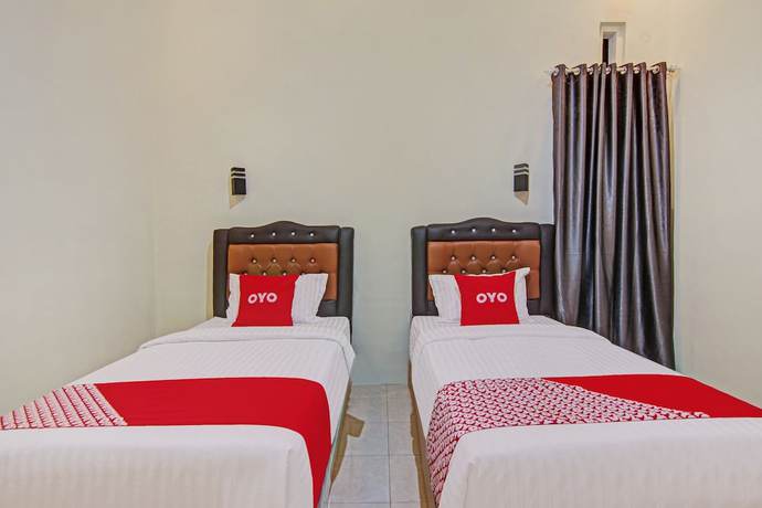 Imagen de la habitación del Hotel Capital O 90643 Suri Guest House Syariah. Foto 2