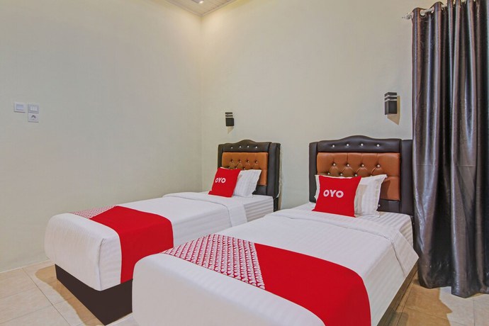 Imagen de la habitación del Hotel Capital O 90643 Suri Guest House Syariah. Foto 6