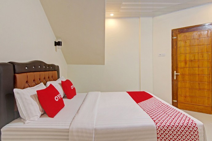 Imagen de la habitación del Hotel Capital O 90643 Suri Guest House Syariah. Foto 11