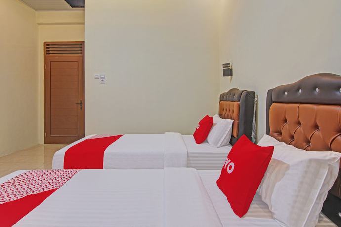 Imagen de la habitación del Hotel Capital O 90643 Suri Guest House Syariah. Foto 12
