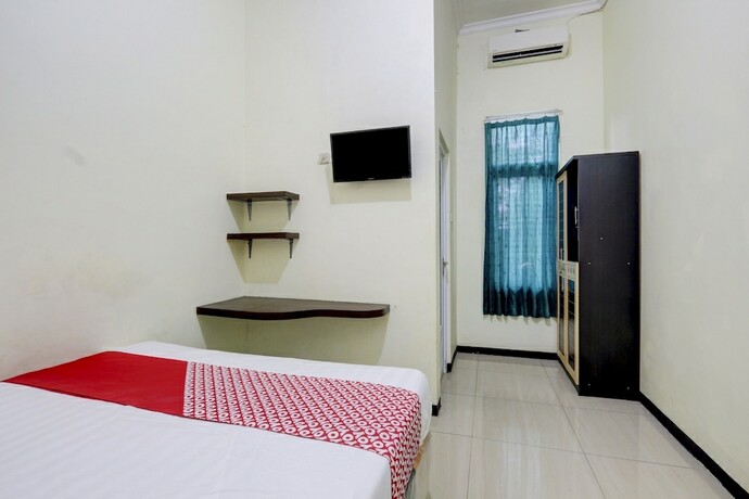 Imagen de la habitación del Hotel Capital O 90709 Djati Guest House. Foto 15