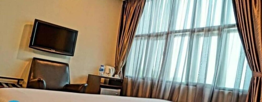 Imagen de la habitación del Hotel Capital O 90767 Rail. Foto 8