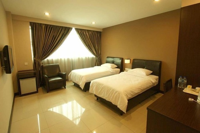 Imagen de la habitación del Hotel Capital O 90767 Rail. Foto 14