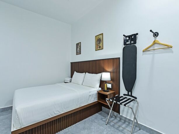 Imagen de la habitación del Hotel Capital O 90882 Padi. Foto 13