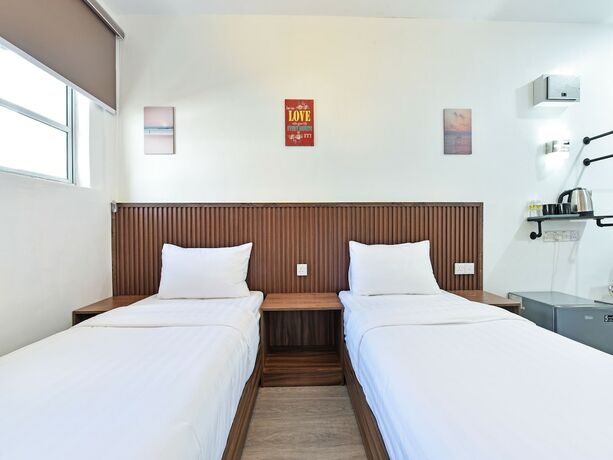 Imagen de la habitación del Hotel Capital O 90882 Padi. Foto 18