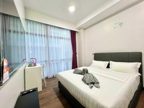 Imagen de la habitación del Hotel Capital O 90985 Margo KK. Foto 18