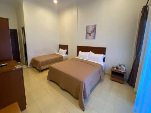 Imagen de la habitación del Hotel Capital O 91094 & Chalet Sportfishing. Foto 18