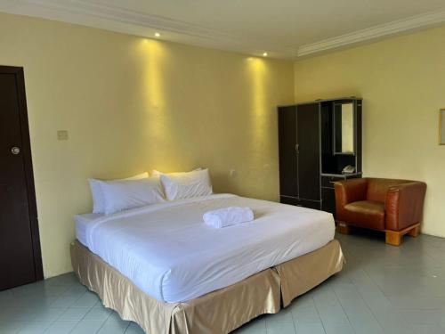 Imagen de la habitación del Hotel Capital O 91096 Usas Resort. Foto 15