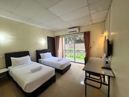 Imagen de la habitación del Hotel Capital O 91096 Usas Resort. Foto 16