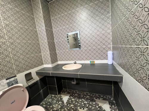 Imagen de la habitación del Hotel Capital O 91096 Usas Resort. Foto 20