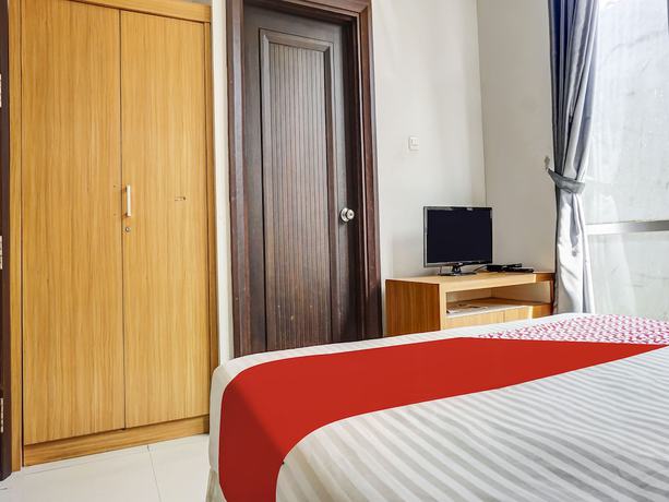 Imagen de la habitación del Hotel Capital O 91140 Ayodya Kebon Jeruk, Yakarta Barat. Foto 3
