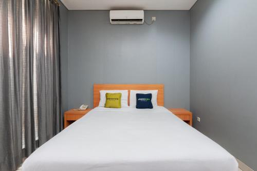 Imagen de la habitación del Hotel Capital O 91140 Ayodya Kebon Jeruk, Yakarta. Foto 15