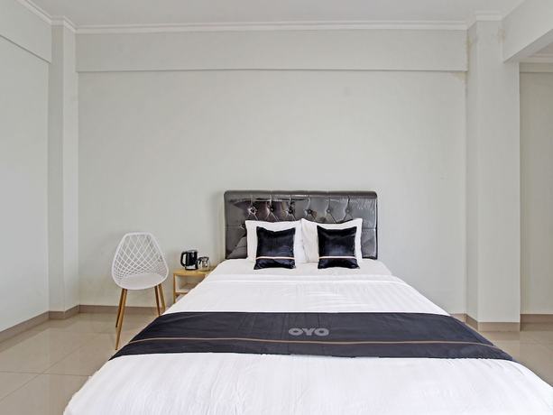 Imagen de la habitación del Hotel Capital O 91377 Mk Prime Syariah. Foto 2
