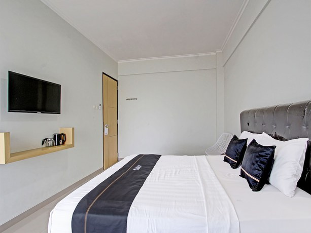 Imagen de la habitación del Hotel Capital O 91377 Mk Prime Syariah. Foto 5