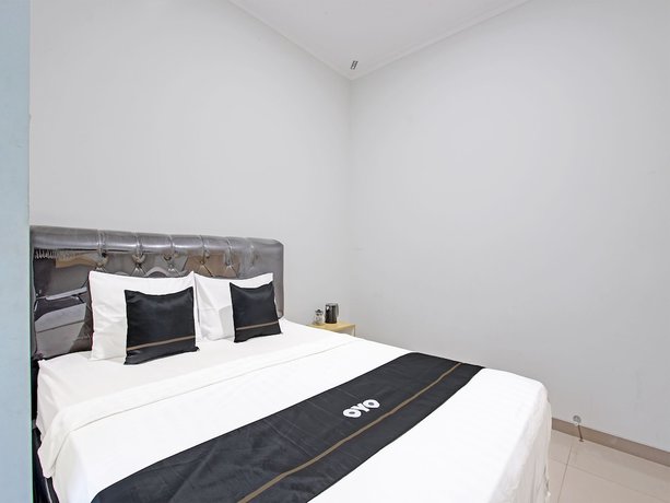 Imagen de la habitación del Hotel Capital O 91377 Mk Prime Syariah. Foto 6