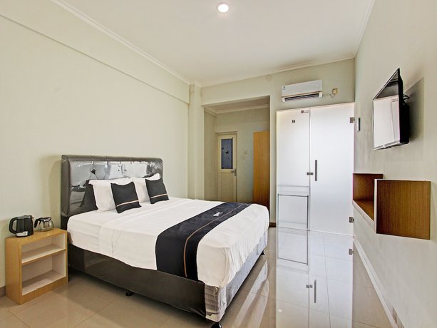 Imagen de la habitación del Hotel Capital O 91377 Mk Prime Syariah. Foto 7