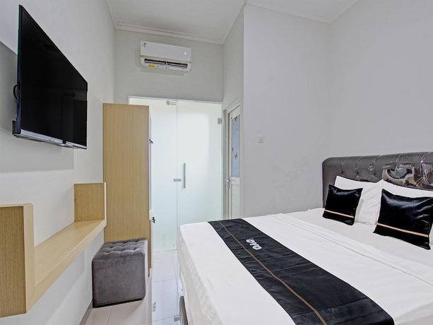 Imagen de la habitación del Hotel Capital O 91377 Mk Prime Syariah. Foto 8