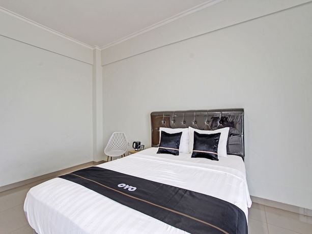 Imagen de la habitación del Hotel Capital O 91377 Mk Prime Syariah. Foto 9