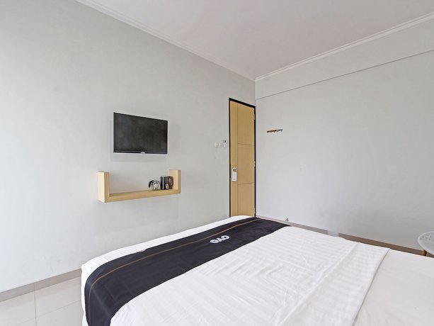 Imagen de la habitación del Hotel Capital O 91377 Mk Prime Syariah. Foto 10