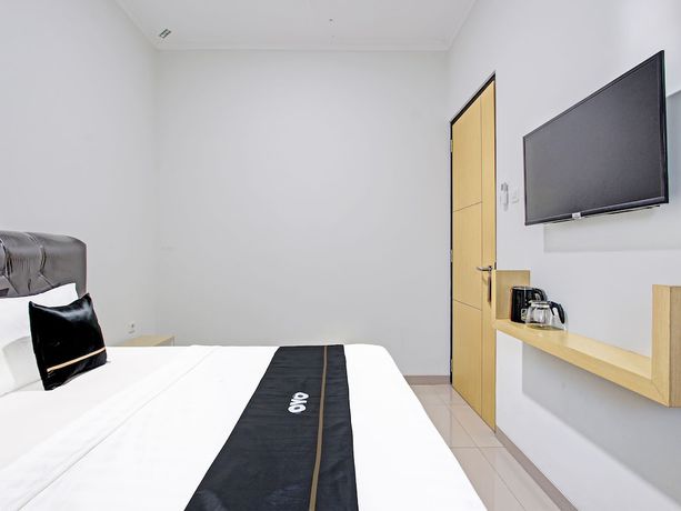 Imagen de la habitación del Hotel Capital O 91377 Mk Prime Syariah. Foto 11