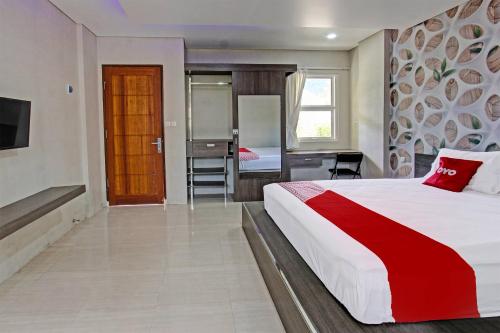 Imagen de la habitación del Hotel Capital O 91384 Rintaka Residence. Foto 20