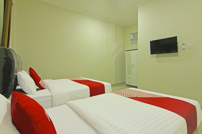 Imagen de la habitación del Hotel Capital O 91675 Utama Residence. Foto 3